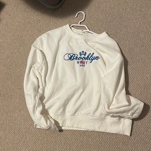 white brooklyn NY sweater